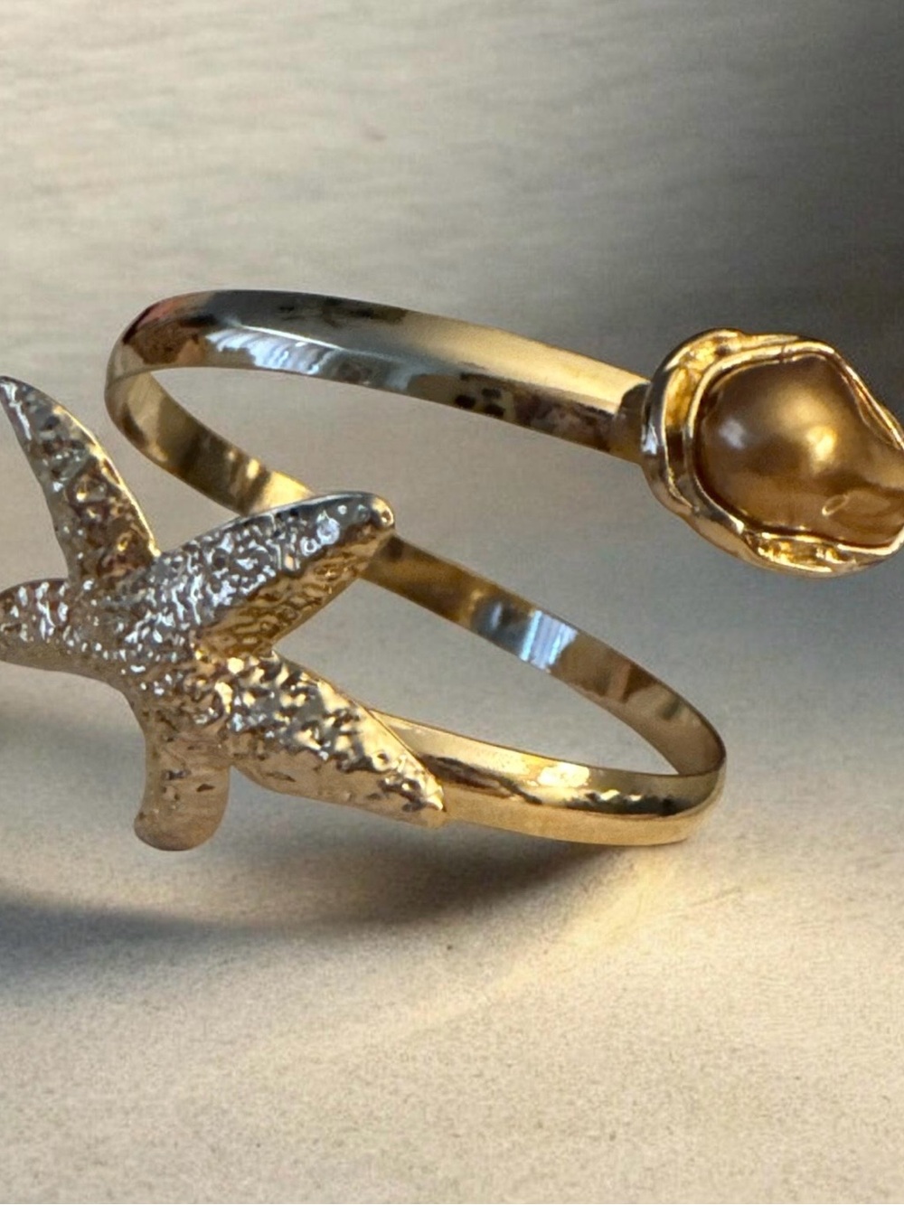 Gold Starfish and Pearl Accent Open Cuff Bracelet